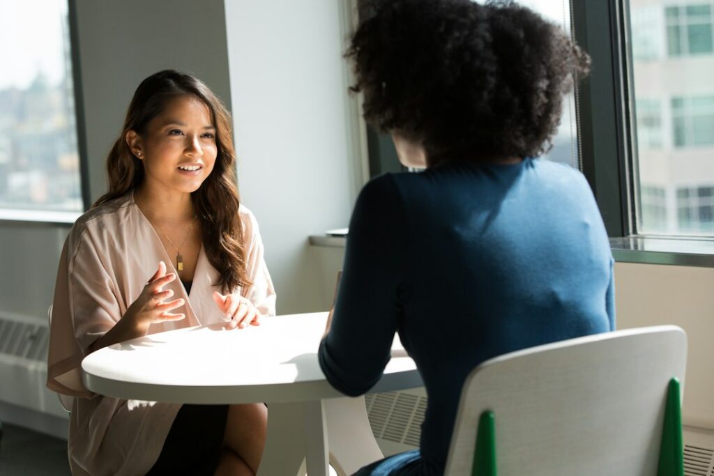 Two people seated in conversation