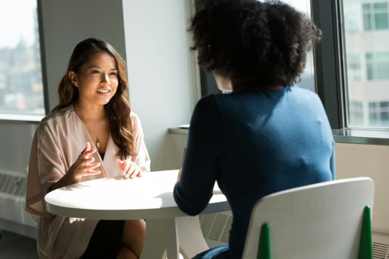 Two people seated in conversation